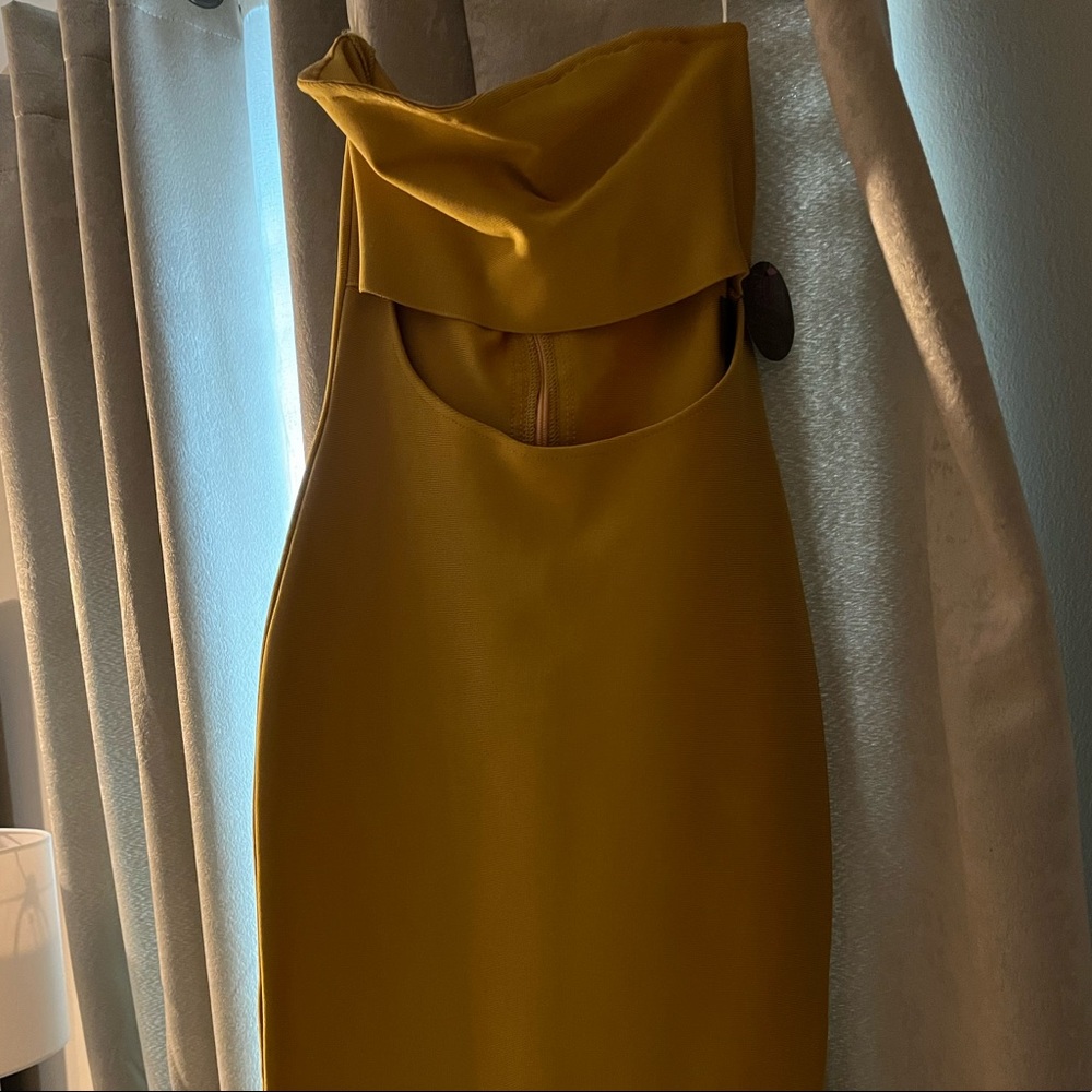 Woman’s mustard cut out stomach body on dress